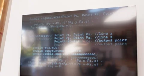 Hand cam is shifting down, revealing lower code on screen and glare reflecting Stock Footage 335781594