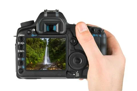 Hand with camera and Gitgit Waterfall in Bali Indonesia (my photo) Hand wi... Stock-Fotos