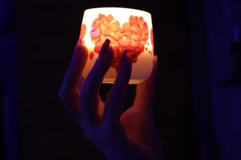 Hand candle night Stock Photos