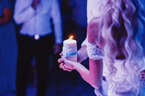 Hand with candle Stock Photos