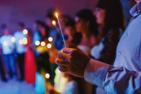 Hand with candle	 Stock Photos