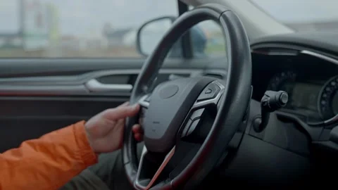 Hand on car wheel with dashboard view Stock Footage 306097755