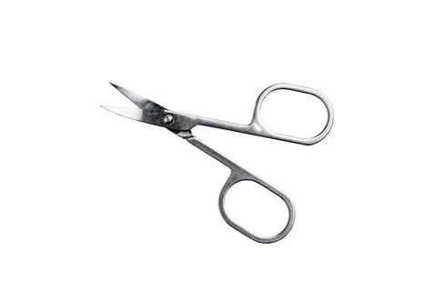 Hand care tool - small shiny stainless steel manicure scissors, isolated on w Stock Photos