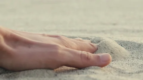 Hand Caresses the Sand. Close-up Stock Footage 175811487