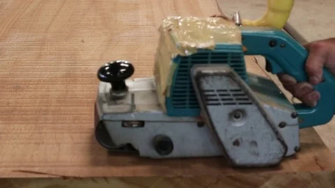 Hand of carpenter using belt sander with wooden board in workshop 스톡 동영상 79479379