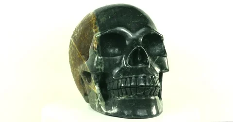 Hand-carved Polychrome Jasper Skull seamless loop on white background Stock Footage 170091313