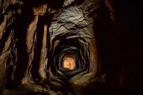 Hand Carved Tunnel Interior with Dramatic Light and Rock Texture Kanab Utah Stock-Fotos