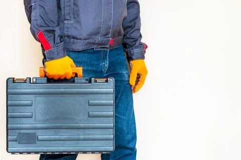 Hand with a case. gloves, tool box, person Stock Photos