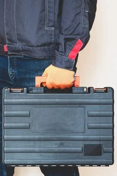 Hand with a case. gloves, tool box, person Stock Photos