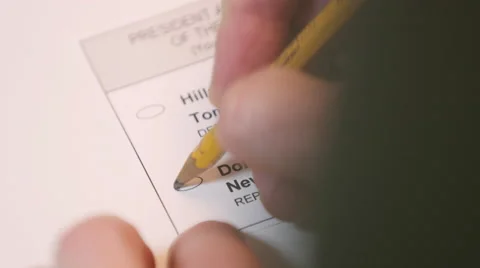 Hand casting a ballot paper to Donald Trump 스톡 동영상 64455338