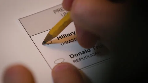 Hand casting a ballot paper to Hillary Clinton Stock Footage 64452724