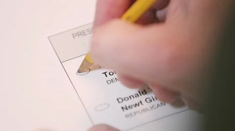 Hand casting a ballot paper to Hillary Clinton Stock Footage 64455350