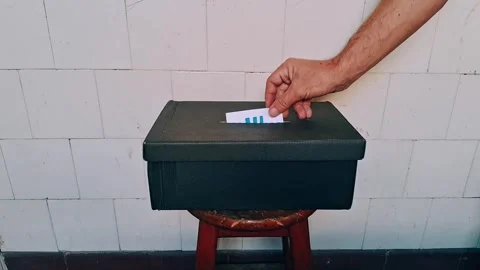Hand casting democratic ballot into black voting box motion clip animation Stock Footage 341626278