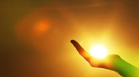 The hand catches sun in a fist Stock Footage