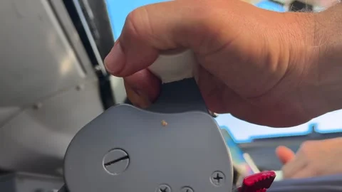 Hand of a Caucasian Pilot Adjusting Thrust Levers Inside Jet Airplane Cockpit Stock Footage 328997401