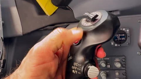 Hand of a Caucasian Pilot (Captain Side), Pushing the AP Disconnect Button to Stock Footage 328081542