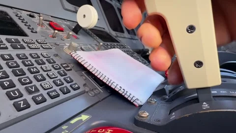 Hand of a Caucasian Pilot Operating Smoothly the Speed Breaks Inside a Jet Stock Footage 328997387