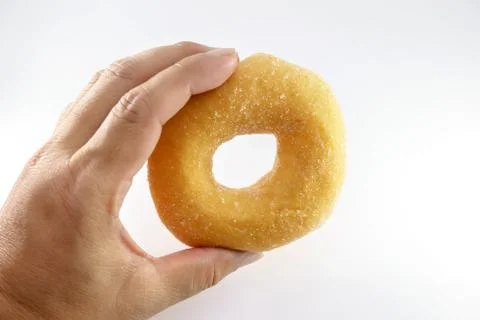 Hand is caught a doughnut Foto stock