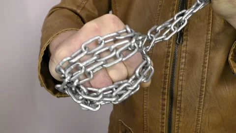 Hand with chain on a white background.  Concept of Fight and Freedom. Stock Footage 146510184
