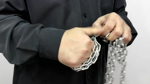 Hand with chain on a white background.  Concept of Fight and Freedom. Stock Footage 146510191