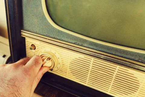 Hand changes channel. Foto stock