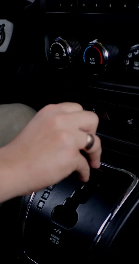 Hand changing gear in a modern car with visible... Stock Footage 313951029
