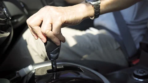 Hand Changing Gear, switches the automatic transmission's Stock Footage 148024796