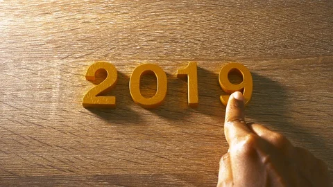 Hand changing number 2018 to 2019 on wooden table , new year coming concept , Stock Footage 97104132
