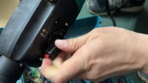 Hand changing operating mode on rotary hammer drill control switch, power tool Stock Footage 337121682