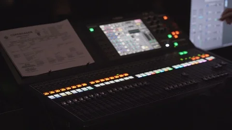 Hand changing settings on audio sound mixer console Stock Footage 113401053