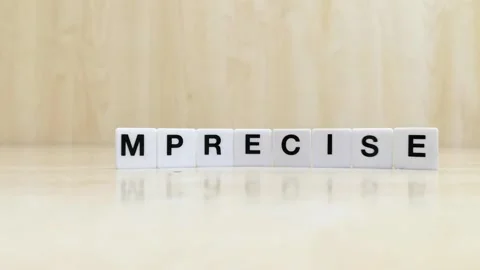 A hand changing the word imprecise to precise with letters Stock Footage 246608816