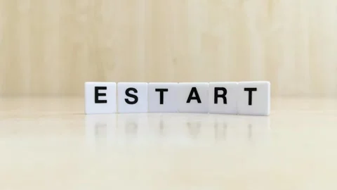 A hand changing the word start to restart with letters Stock Footage 246608830