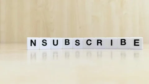 A hand changing the word subscribe to unsubscribe with letters Stock Footage 246608835