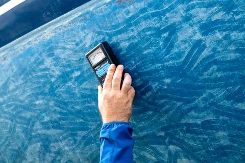 Hand Checking Boat Hull Surface With Inspection Meter Stock Photos