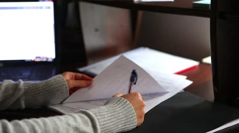 Hand checking documents and signing Stock Footage 56909122