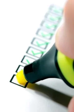 Hand is checking a questionnaire, education or business concept. Stock Photos