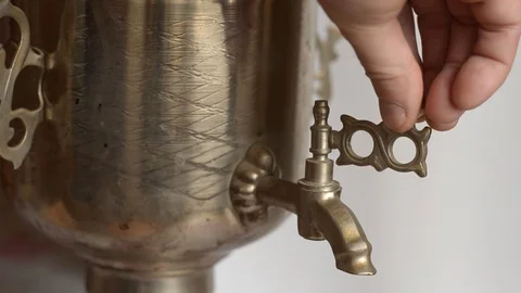 Hand checks the operation of the crane of an antique samovar. Stock Footage 119869729