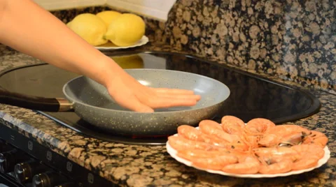 Hand Checks Whether The Pan Is Hot Enough Stock Footage 52161379