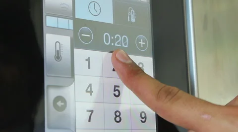 Hand of Chef cooker changing settings and temperature of the oven in the kitchen Stock Footage 48470937