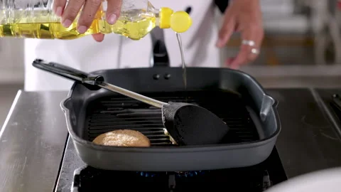 Hand chef cooking kitchen school show fried eggs with techniques skill to y.. Stock Footage 245483373