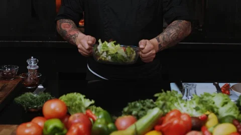 Hand chefs at work in a restaurant kitchen cooking salad culinary cutting Stock Footage 100303464