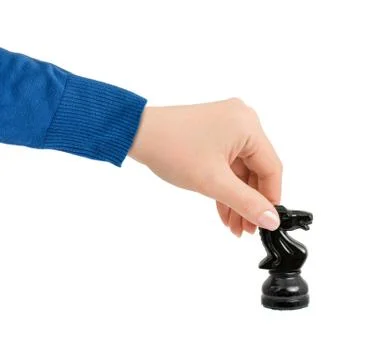 Hand with chess knight Foto stock
