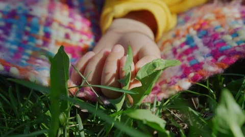 Hand of a child on a blanket Stock Footage 100003905