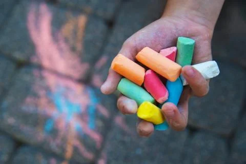 Hand child drawing chalk colours on blackboard Stock Photos