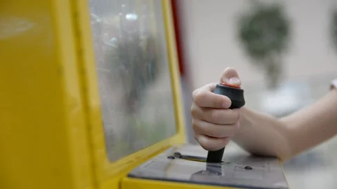 Hand of a child playing a game on toy crane machine Video stock 111661894