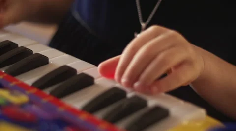 Hand of a child playing keys Stock Footage 56303831