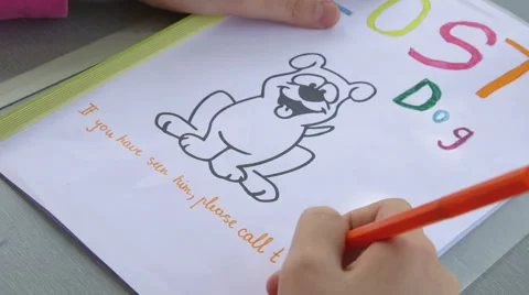 Hand of a child writing missing pet sign Stock Footage 40431234