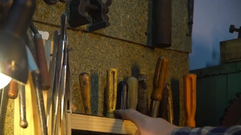 The hand chooses the right screwdriver among the others Stock Footage 126749371