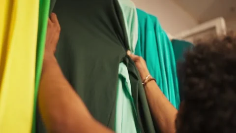 Hand choosing clothes in clothing store Stock-Footage 345861019