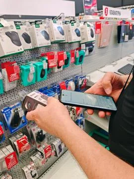 Hand Choosing Computer Mouse in Store Stock Photos
